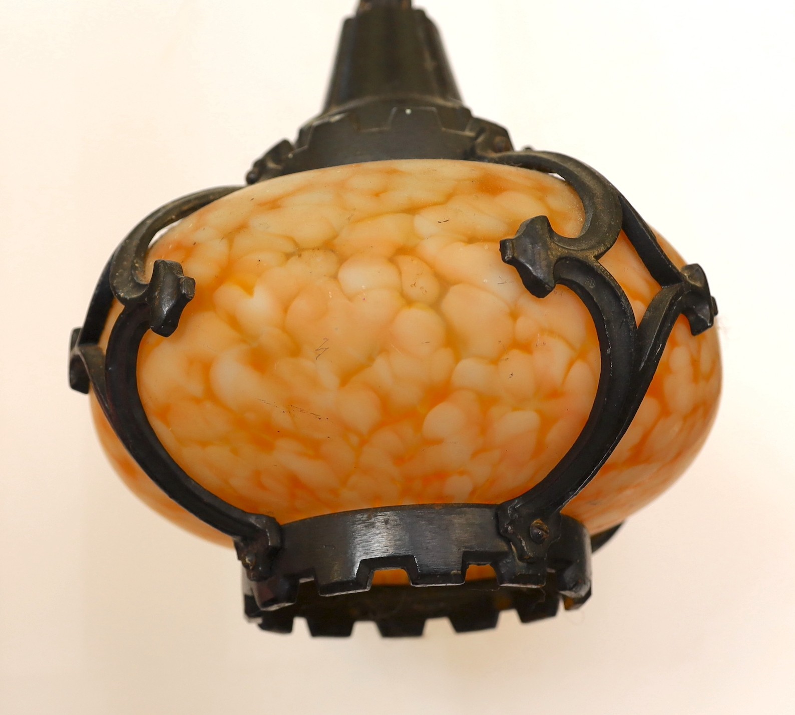 A pair of early 20th century Continental cast iron and marbled glass ceiling lights, height 28cm